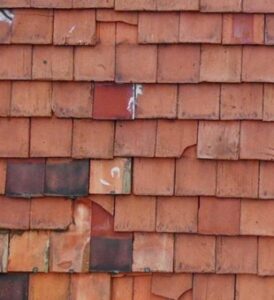 Exposed roof tile clips, cracked and missing roof tiles (DJI_0957)